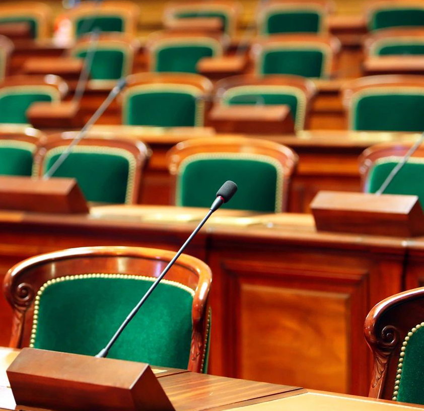 A large room with many chairs and tables